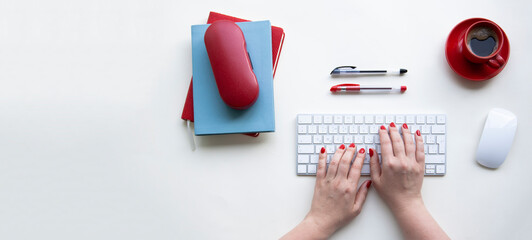 Office desktop with copy space. Woman hands on laptop keyboard - 517161733