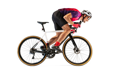 Portrait of man, professional cyclist training, riding isolated over white studio background. Side...