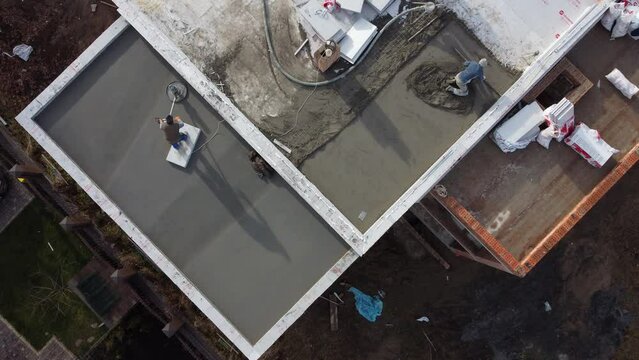 Roofing construction worker installing a flat roof.
