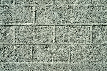 Pattern of large blocks of a block work wall all painted the same colour