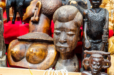 African tribal art for sale at a market stall.