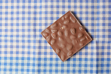 dark chocolate on a plate on table close up 