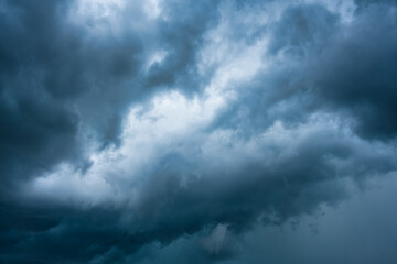 Moody dramatic blue sky and stormy cloud during thunderstorm
