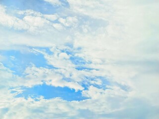 Obraz premium blue sky Bright colors on a sunny day with white clouds, beautiful sky.