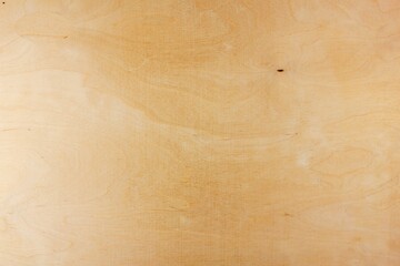 Authentic texture of light plywood. Plywood wooden material texture. The wooden background is light.
