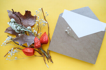 greeting card design. autumn composition of their dry leaves and flowers