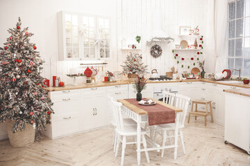 Fototapeta na wymiar Christmas decoration on the kitchen. Kitchen interior holidays. New Year design.