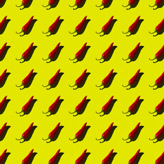 flat seamless pattern of red hot pepper on a yellow background