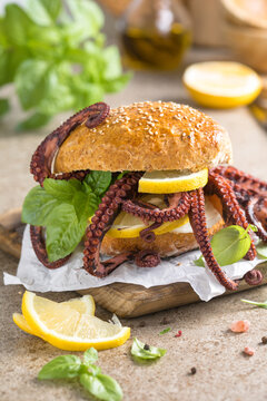 tasty and delicious hamburger fresh with octopus  fast food meal lunch dinner breakfast food big fish burger homemade restaurant french fries ketchup