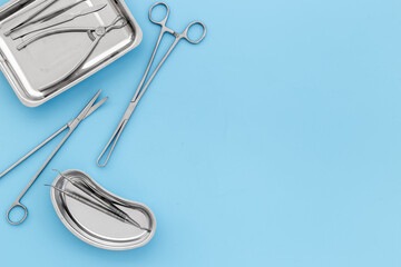 Medical equipment tools instruments in steel tray at doctor desk