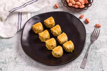 Pistachio baklava. Baklava filled with pistachio on a stone floor. Turkish cuisine desserts. close up