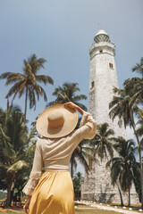 Woman traveler visiting famous landmarks of Sri Lanka country standing and looking on Dondra...