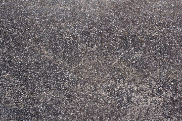 Cement wall with grainy speckled texture