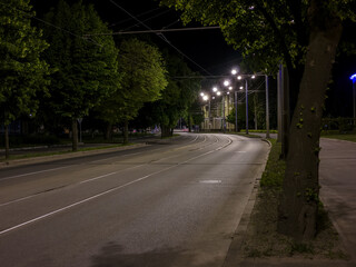 Empty night street lit by lanterns. Ukraine, Kharkiv