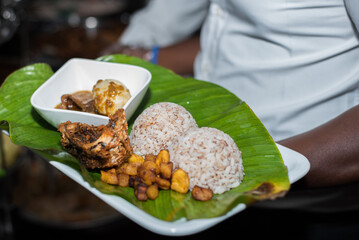 Local ofada rice, plantain, and egg served in a leaf the traditional way © Tolu Owoeye