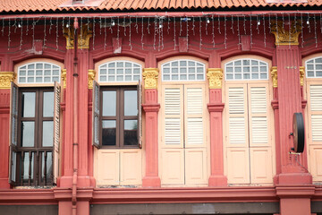 detail shot of vintage red color windows on a buildings 