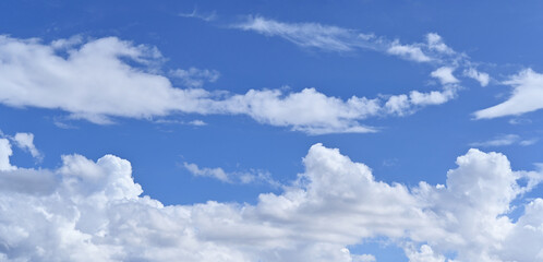 Naklejka na ściany i meble Blue sky background with white clouds look like happy dragon.