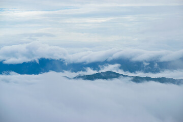 Fototapeta na wymiar Beautiful view of foggy morning in the mountains covered with white clouds