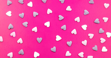 Close-up of a postcard, many small hearts. Festive abstract background.
