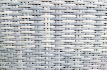 White textured surface of interlaced rattan strings. Basket weave pattern closeup textured background, Handicraft concept. White Bamboo wood texture. White wicker background. Perfect simplistic design