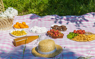 Picnic products on a tablecloth in a cell.