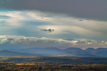 Area view of mountains and hills in sunset light and cloudy sky, Gertrude's Nose NY. High-quality photo