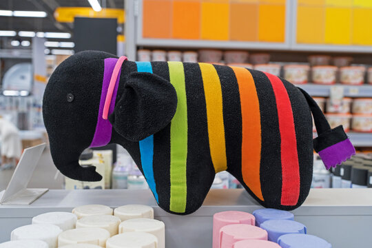 Caparol Company logo - Plush colored striped elephant, a symbol of company Caparol at paint store. Minsk, Belarus, 2022