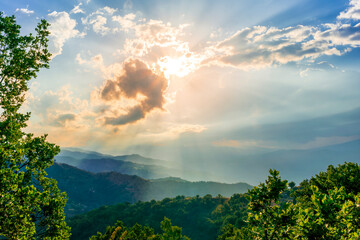 Mountain valley during sunset or sunrise. Natural spring or summer season landscape