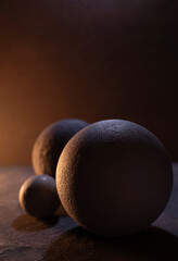 Cement sphere against concrete wall at floor. Abstract geometric or space concept