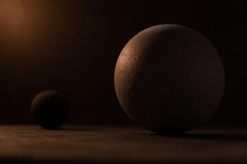 Concrete sphere against cement wall on floor. Abstract geometric or space concept