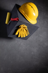 Concrete cube and construction tool on floor background texture. Cement block and work tools