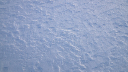Texture of white snow with natural roughness.