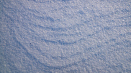 Texture of white snow with natural roughness.