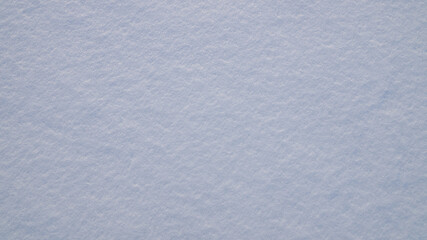 Texture of white snow with natural roughness.