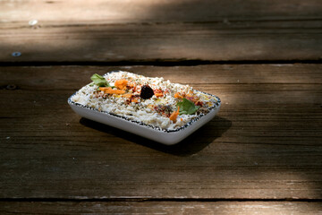 Yoghurt appetizer on a wooden table.