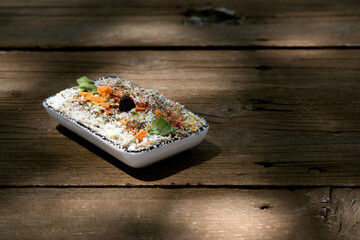 Yoghurt appetizer on a wooden table.