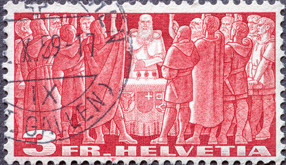 Switzerland - CIRCA 1942: a postage stamp from Switzerland, showing a men's union when swore while sealing of the Federal Charter of switzerland . Circa 1942.