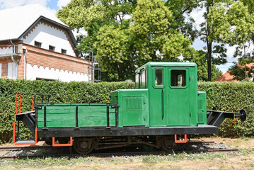 Fototapeta na wymiar Old little green engine on the track