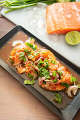 Spicy Raw Salmon Salad Thai food style 