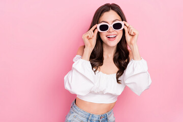 Photo of adorable attractive female in sunglass relaxing summer holidays vacation isolated on pink color background