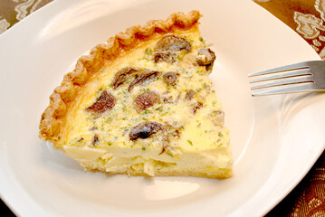 Plated Mushroom Quiche on a White Dish