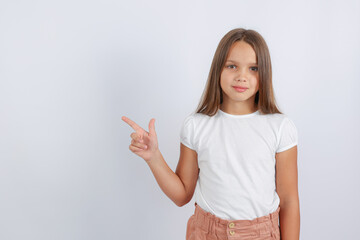 girl pointing at empty space. High quality photo