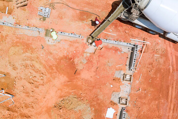 Aerial top view of concrete columns pouring on a construction site