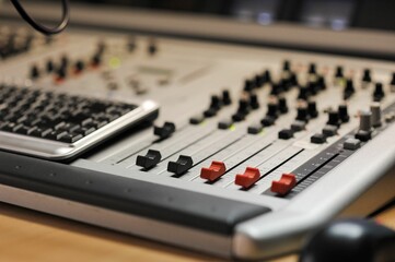 Closeup shot of a mixing console in a recording studio