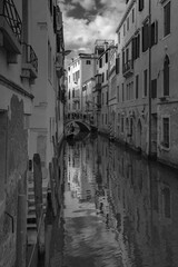 Fototapeta na wymiar Canal reflections in black and white