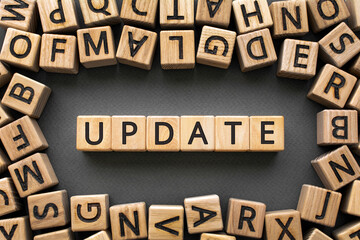 Inscription Update software development concept. Wooden cubes with letters scattered blurred background