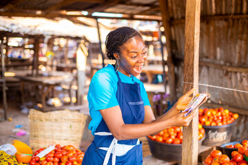market woman holding Nigeria currency