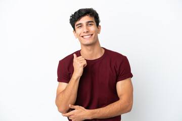 Fototapeta na wymiar Young Argentinian man isolated on white background laughing