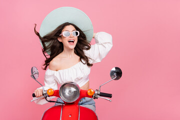 Photo of positive amazed person drive bike enjoy summer vacation isolated on pink color background - obrazy, fototapety, plakaty