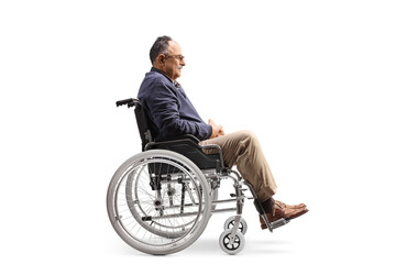 Full length profile shot of a mature man sitting in a wheelchair